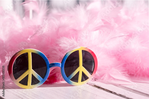 Fotografie, Obraz Hippie style: peace sign sunglasses and pink feather boa