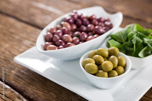Marinated olives with herbs in bowl
