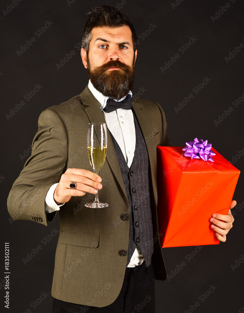 Businessman with concerned face and red gift box