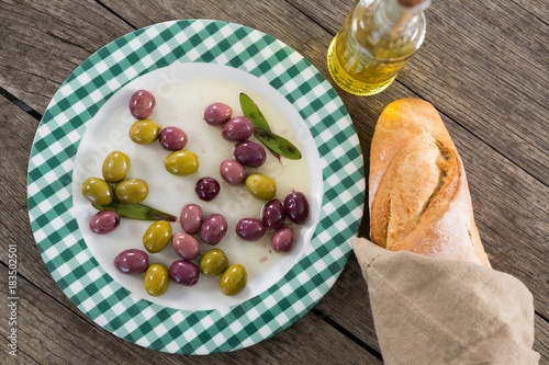 Marinated olives with oil and bread