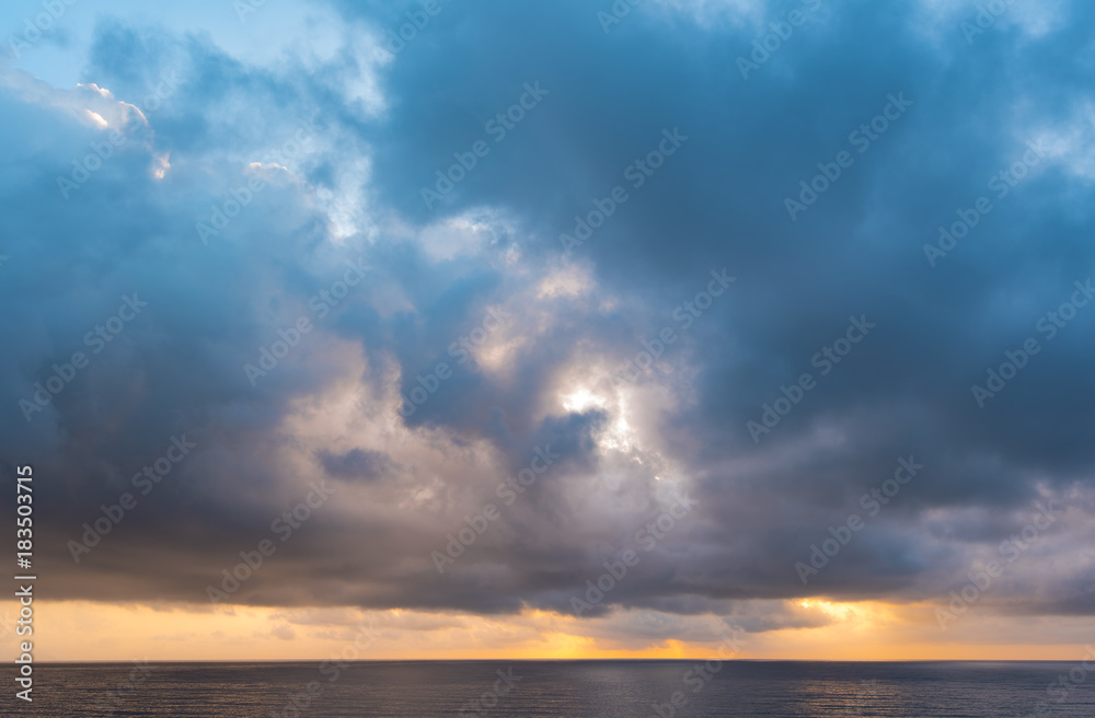 Dramatic cloudy Sky over Sea, morning sky and water, sunrise above ocean