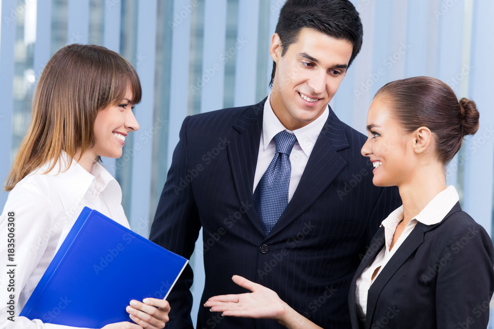 Portrait of three businesspeople at office