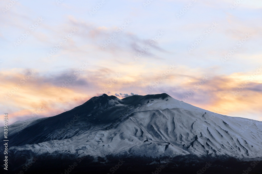 landscape of mountain Etna volcano with colorful sky at sunset in Sicily 