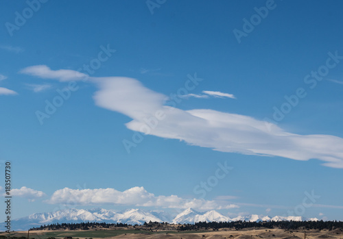 Snowcapped Yellowstone Mountain Landscape with beautiful clouds over snowy mountain peaks 
