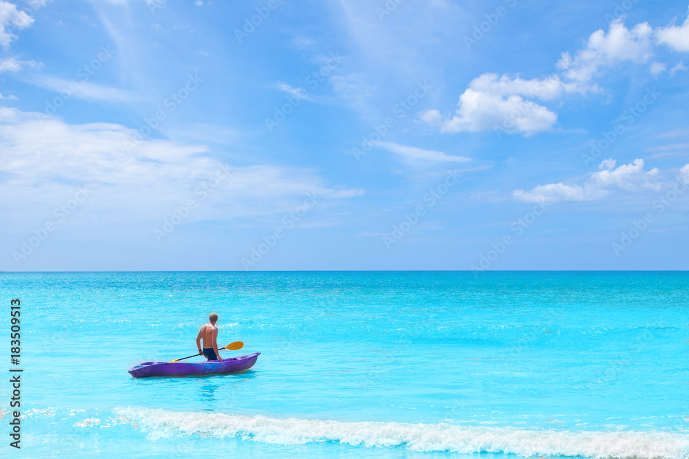 a man pulling kayak in the sea on blue sky vacation holiday summer time concepts