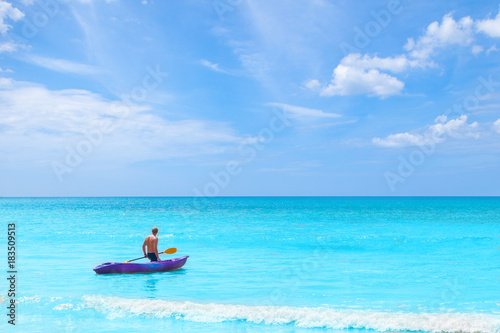 a man pulling kayak in the sea on blue sky vacation holiday summer time concepts © iammotos
