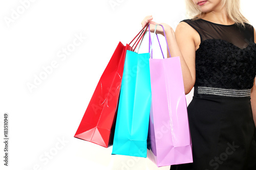 hand girl holding shopping bags after shopping isolated on white background.