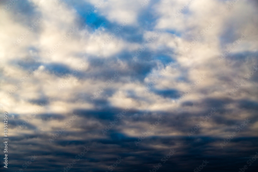 Fototapeta premium clouds in the sky at sunset as background