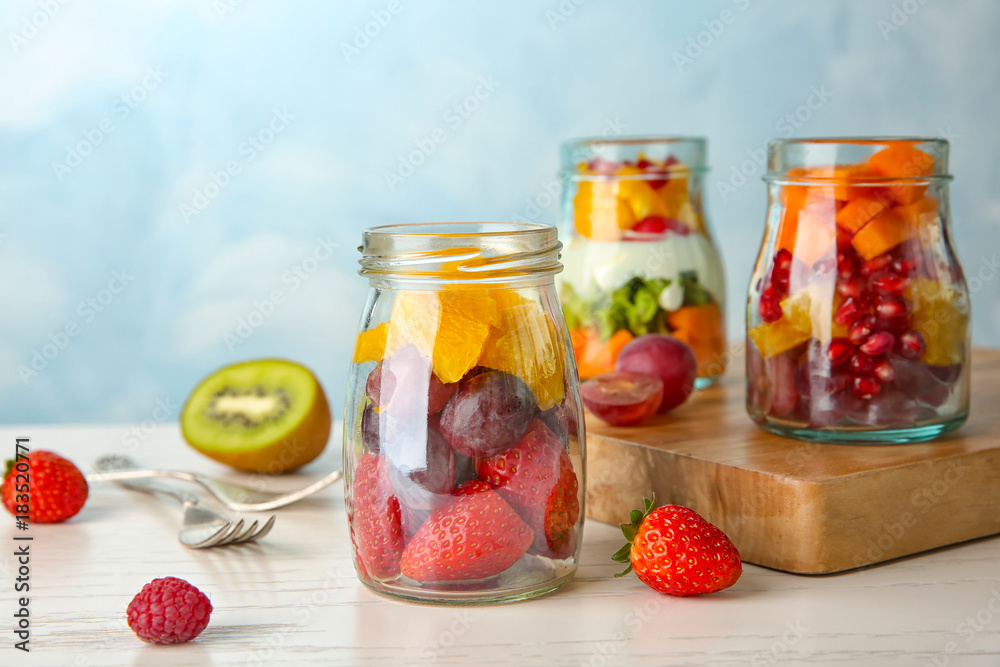 Glassware with delicious fruit salads on table Glassware with delicious fruit salads on table