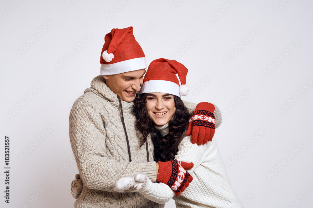 joyful couple on a light background, emotions, new year, christmas