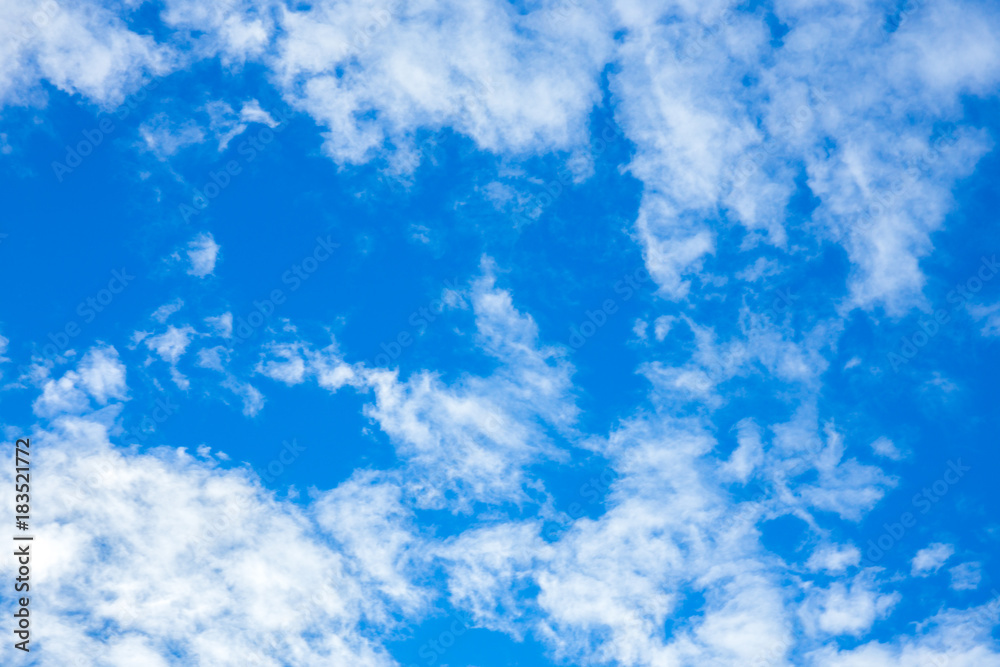 Obraz premium blue sky background with white tiny clouds
