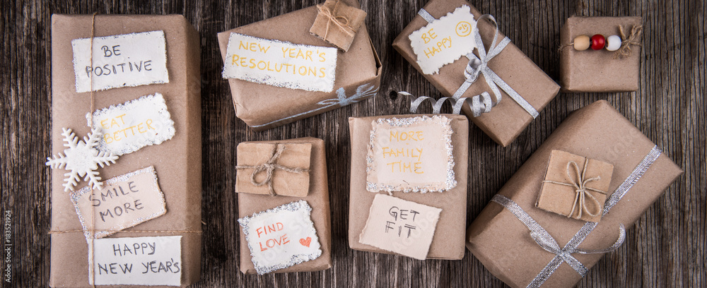 Closeup of gift boxes and new year resolution notes Closeup of gift boxes and new year resolution notes
