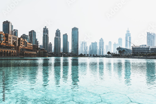 Skyline view of Dubai, UAE, reflected in a pool