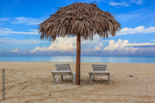 Beach in the Caribbean and umbrellas.