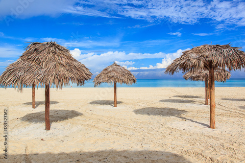 Beach in the Caribbean and umbrellas.