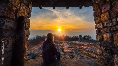 Leinwand Poster Woman watching the sunset along the Appalachian Trail in Stokes State Forest, Ne