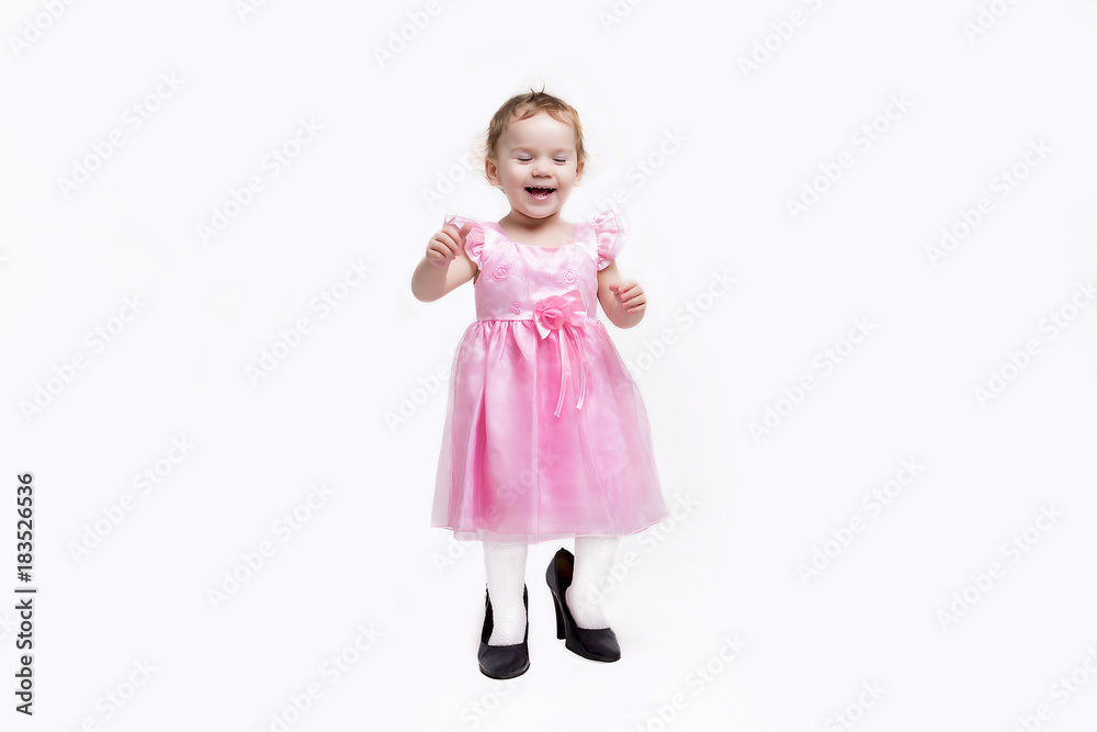 the girl in the pink dress shoes on a white background the girl in the pink dress shoes on a white background