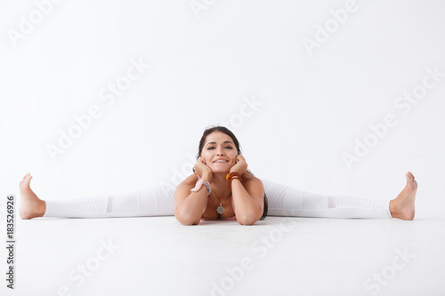 Beautiful young woman doing yoga photo