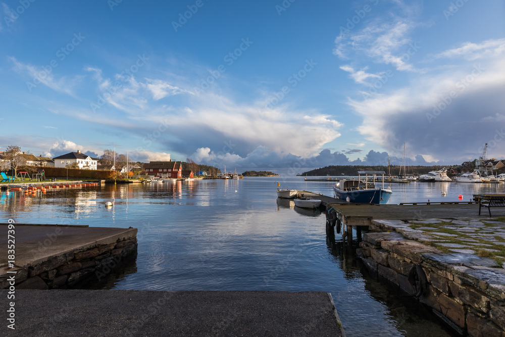 Lillesand, Norway - November 10, 2017: View of the harbour ocean and sky. Seen from Lillesand City.