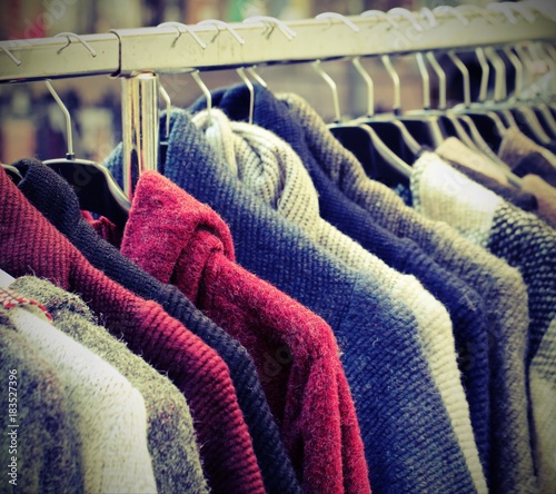 many vintage used clothes in the outdoor flea market
