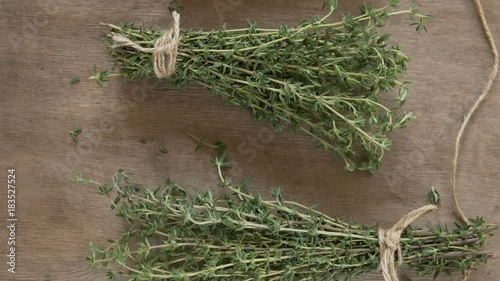 A bunch of thyme on a wooden table.