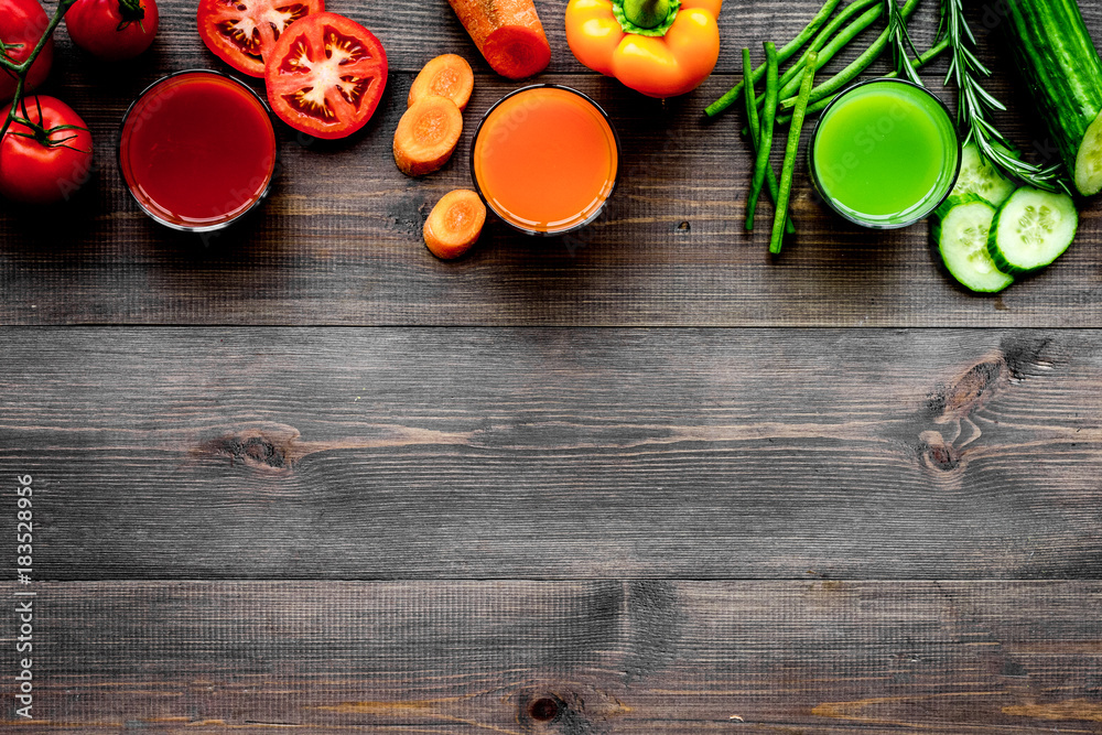 Fresh detox beverages with vegetables and fruits on dark wooden background top view copyspace Fresh detox beverages with vegetables and fruits on dark wooden background top view copyspace