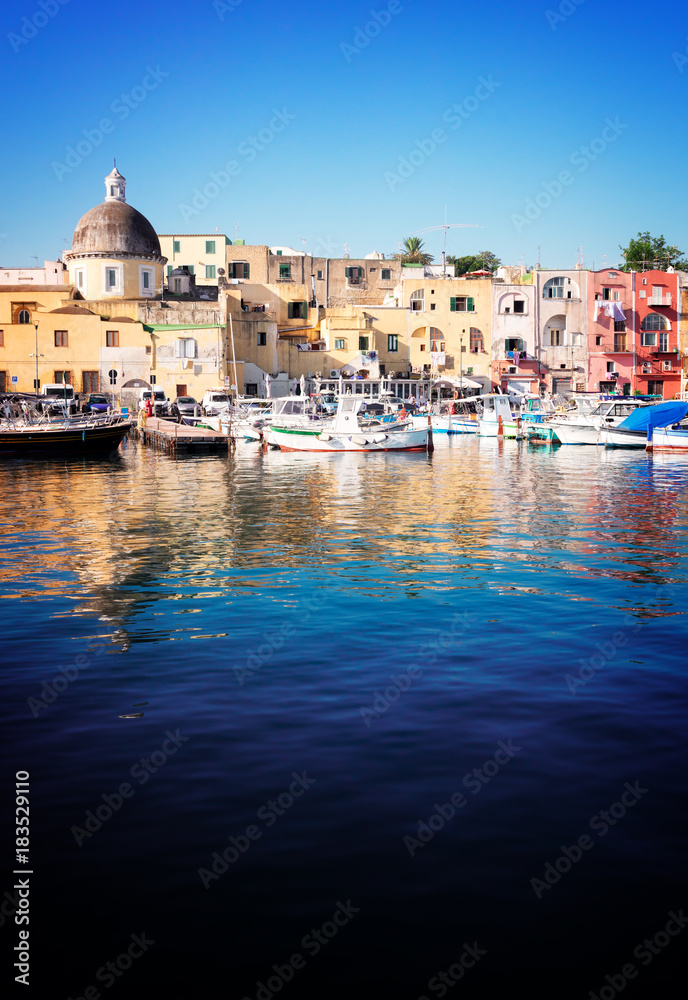 Marina Grande Port with colorful old houses of Procida island, Italy, retro toned