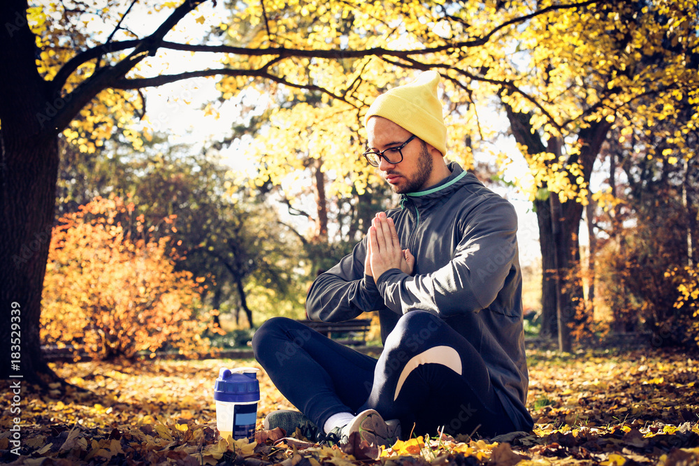 Man exercise yoga. Lotus position.