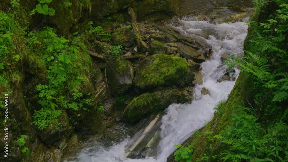 Wide high angle panning shot of scenic view of waterfall / Flattach, Austria Wide high angle panning shot of scenic view of waterfall / Flattach, Austria