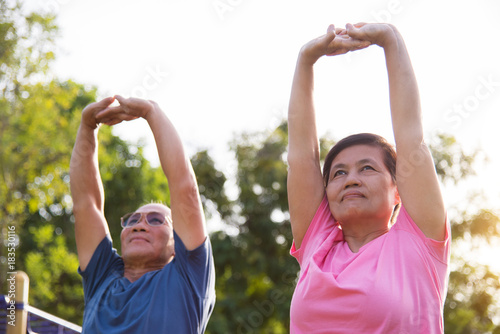 Asian elderly people stretching before exercise.