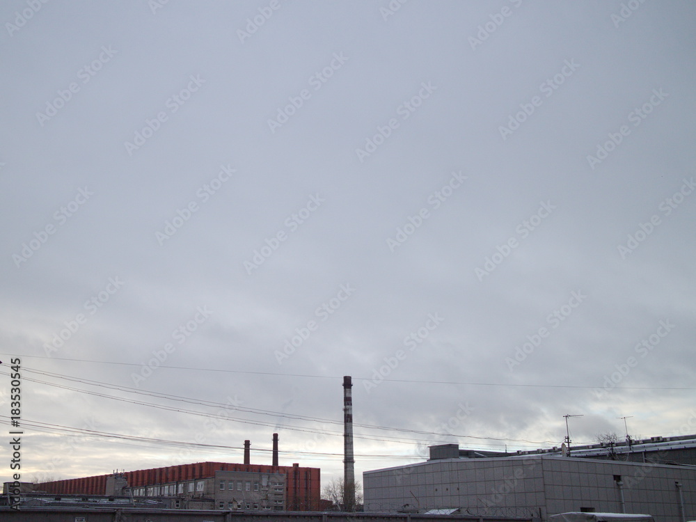 sky, fences, pipes in the industrial city quarter