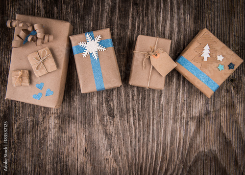 Christmas gift boxes collection on rustic wood and copy space