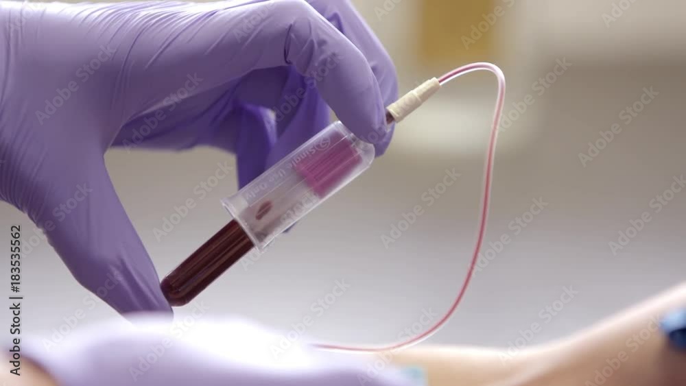 Completing blood draw.