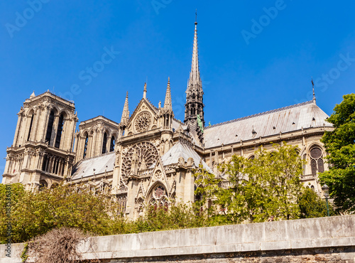 Notre Dame de Paris Catholic Christian Cathedral with the Seine river on a sunny spring day. View from the water. Paris