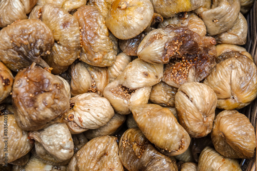 Close up top view dried dried figs. Background of oriental treats texture. Close up top view dried dried figs. Background of oriental treats texture.