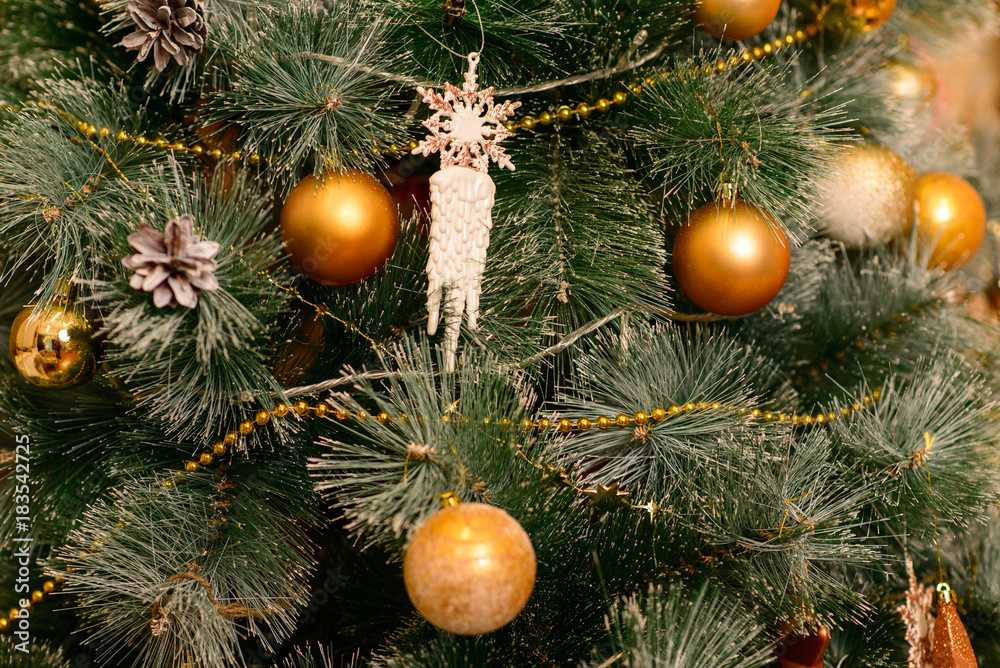 Christmas yellow ball weighs on the branch Christmas yellow ball weighs on the branch