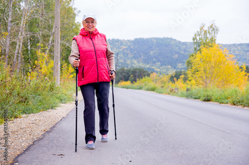 Senior lady nordic walking © Nichizhenova Elena