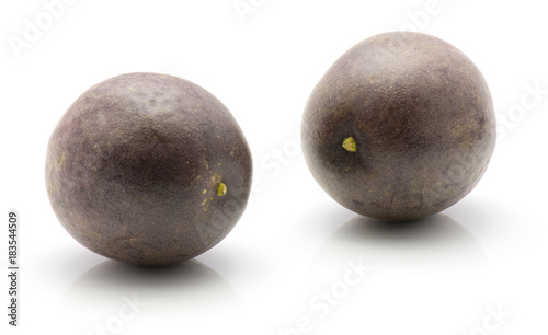 Two passion fruits isolated on white background.