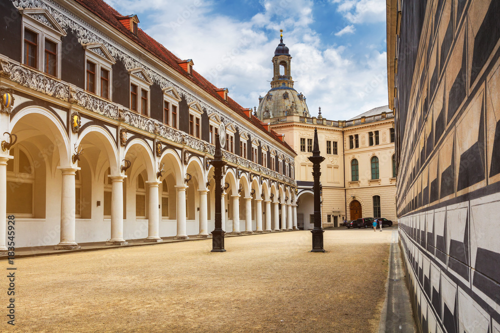 Fototapeta premium View of Stables Courtyard (Stallhof) toward Chancellery Building, George Gate and Hausmannsturm tower of Dresden Castle, Saxony, Germany.