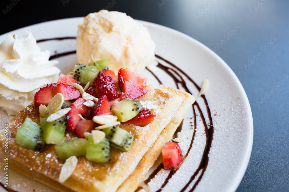Waffles with fresh berries, whipped cream and ice cream Waffles with fresh berries, whipped cream and ice cream