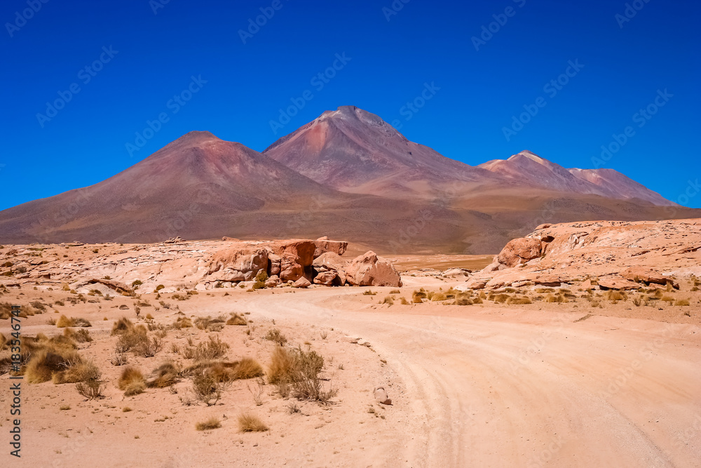 Sandy and gravel desert road through southern Altiplano