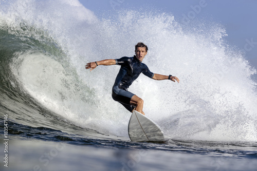 Low angle view of man surfing on sea photo