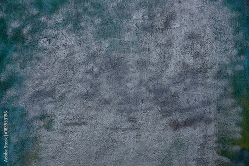 серо зелёный тёмный фон из фрагмента бетонной стены photo
