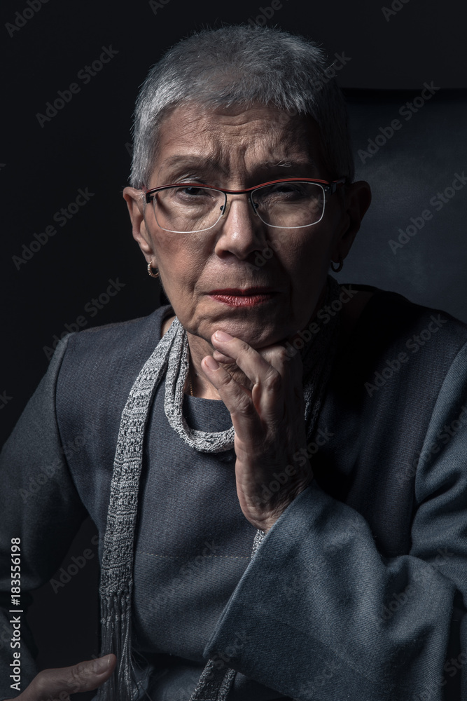 Rich and snobbish senior old woman looking at you with disapproval Rich and snobbish senior old woman looking at you with disapproval