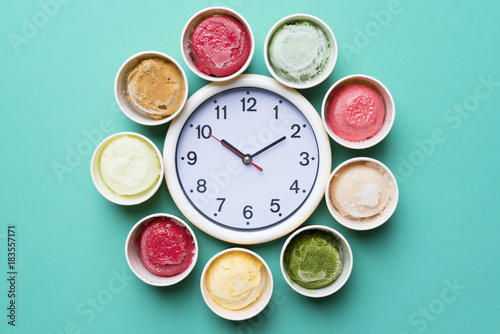 ice cream with a clock on green background
