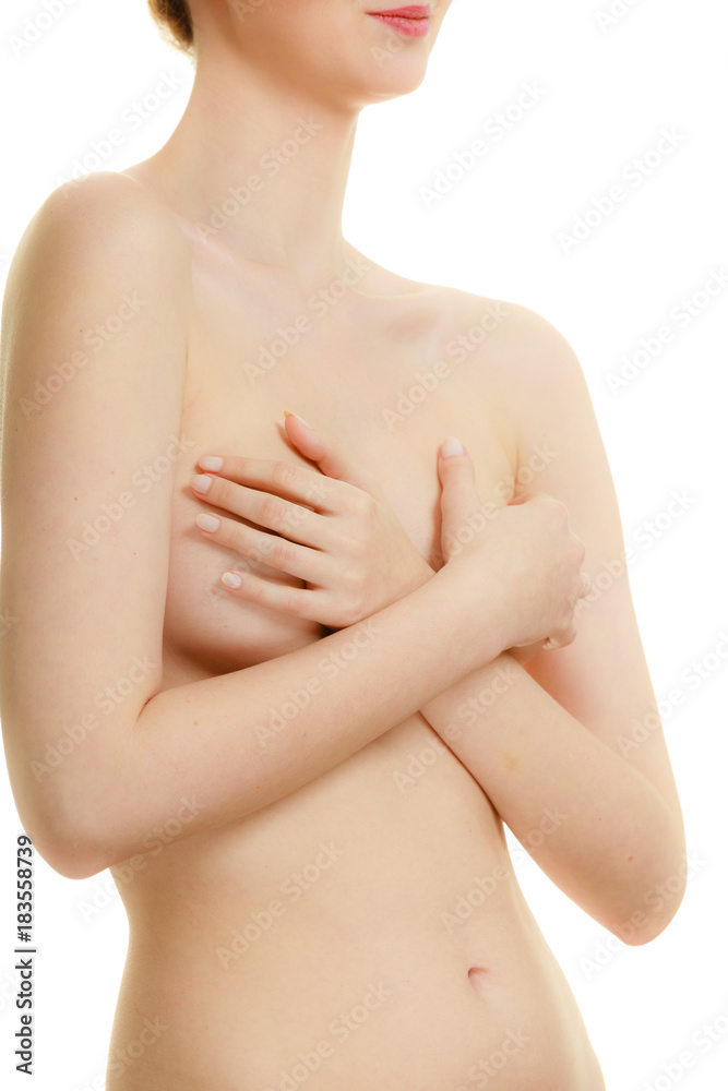 Fototapeta premium Woman covering her breast with hands