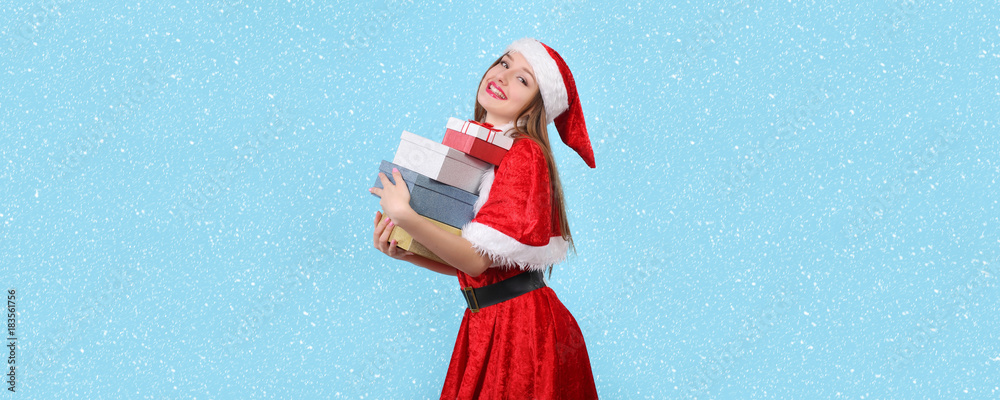Obraz premium Portrait of beautiful sexy girl wearing santa claus clothes