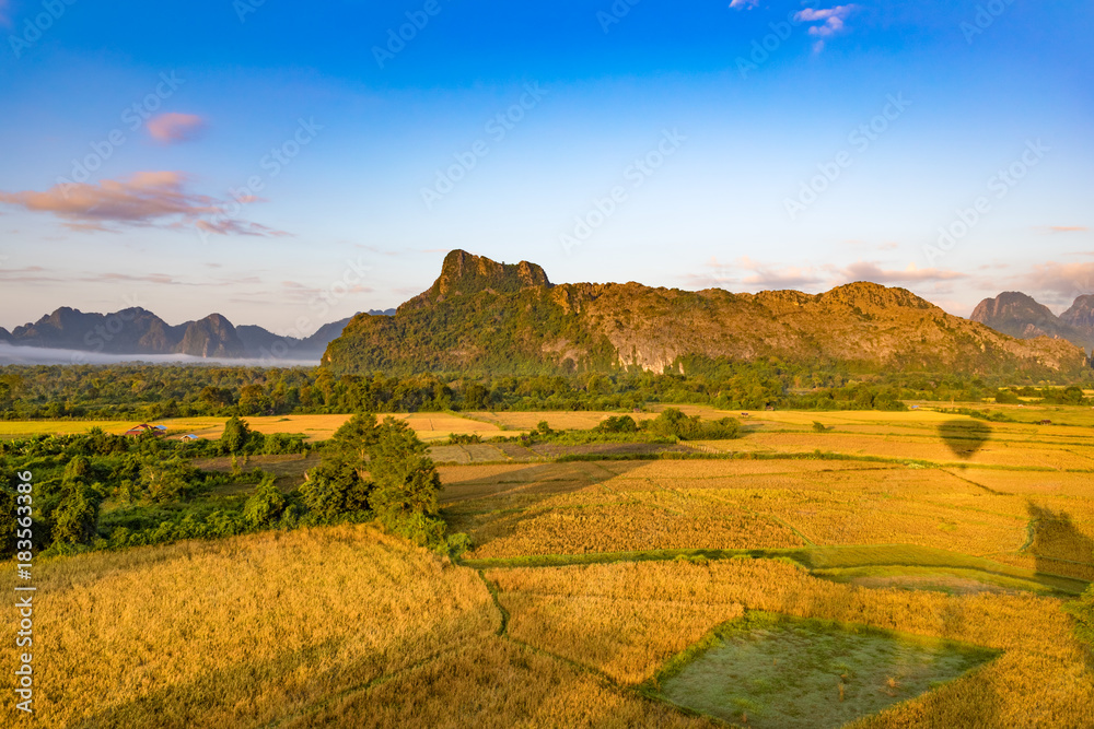 Fototapeta premium Aerial view of the fields and mountain. Beautiful landscape. Laos.