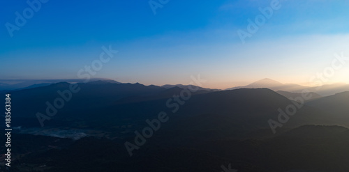 Aerial view of the mountains at sunrise. Beautiful panorama landscape. Laos. © Olga Khoroshunova