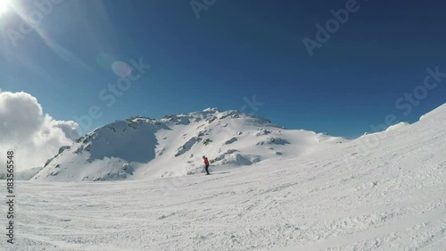 Man skiing on the prepared slope with fresh new powder snow in Tyrolian Alps, Zillertal, Austria 
 photo